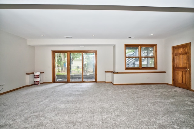 unfurnished living room with carpet