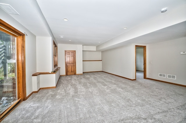 spare room with light colored carpet