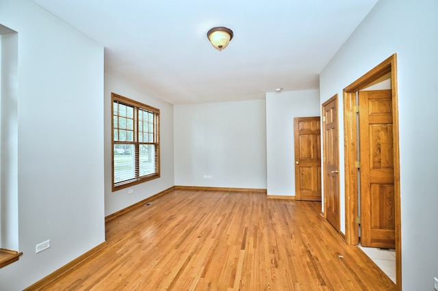 unfurnished room featuring light hardwood / wood-style flooring