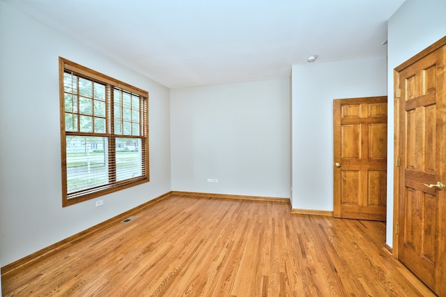 unfurnished room featuring light wood-type flooring