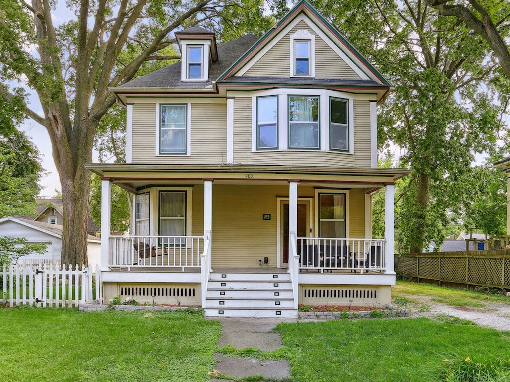 victorian house featuring a porch