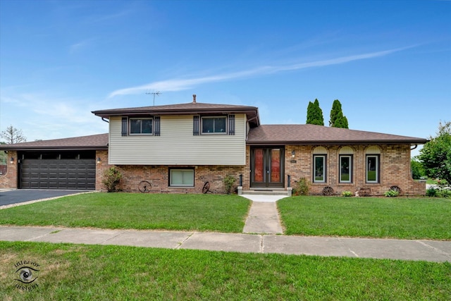 split level home with a garage and a front yard