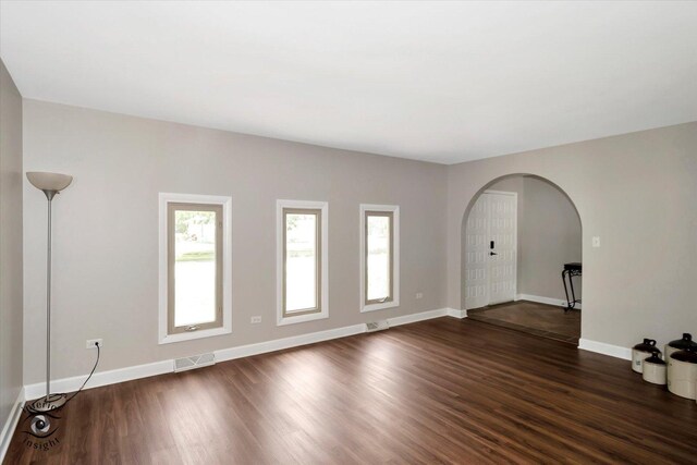 empty room featuring dark wood-type flooring