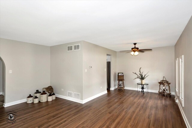 spare room featuring dark hardwood / wood-style floors and ceiling fan