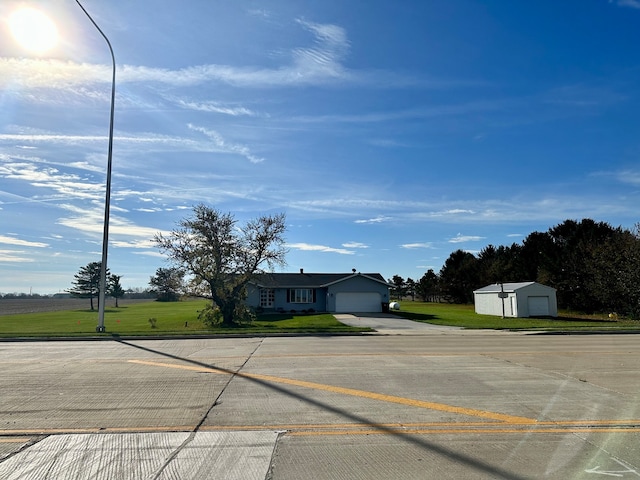 view of front of property with a garage and a front yard