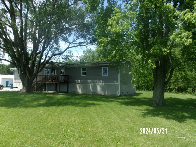 view of yard with a deck