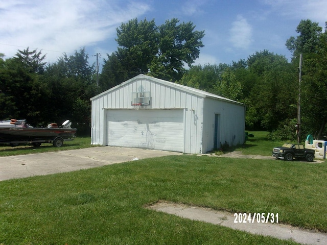 garage featuring a yard