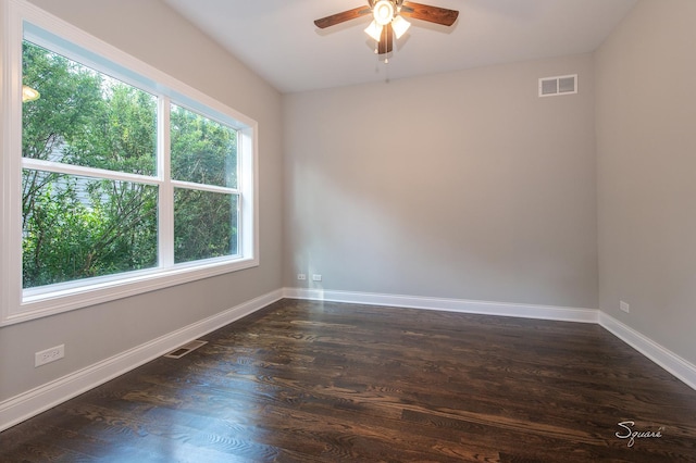 unfurnished room featuring ceiling fan and dark hardwood / wood-style flooring