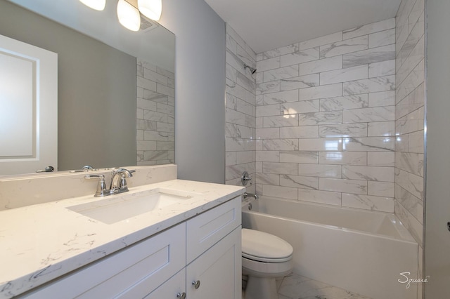 full bathroom featuring tiled shower / bath combo, vanity, and toilet