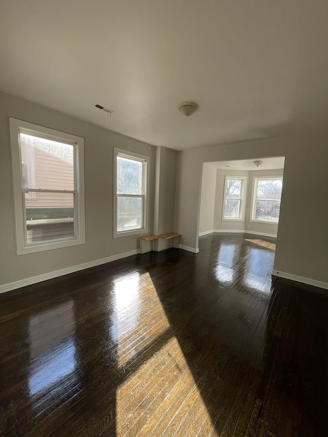 unfurnished room featuring dark hardwood / wood-style flooring