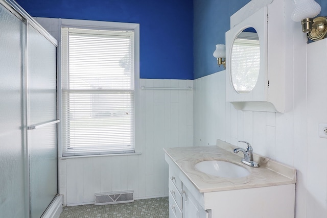 spare room with light carpet, ceiling fan, and a healthy amount of sunlight