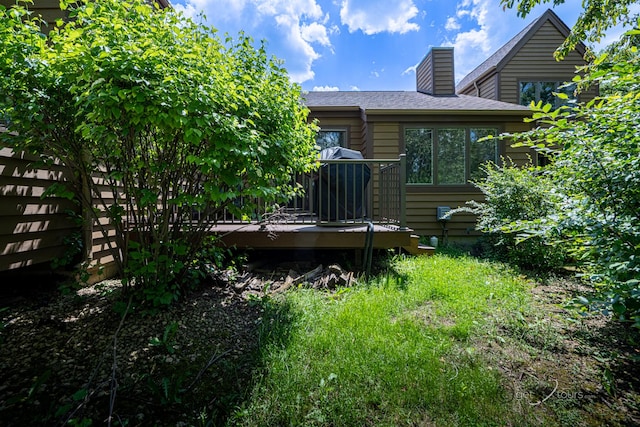 back of property with a wooden deck