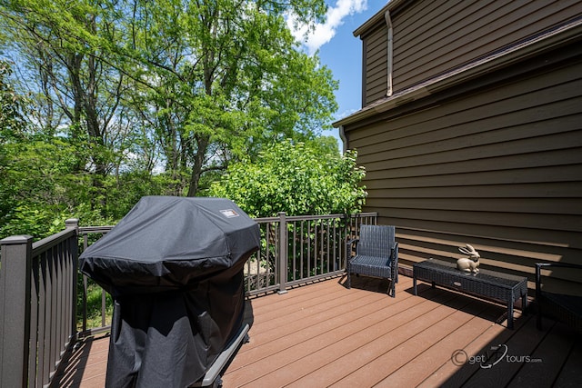 wooden terrace featuring a grill