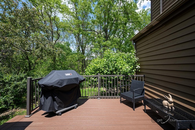 wooden terrace with a grill