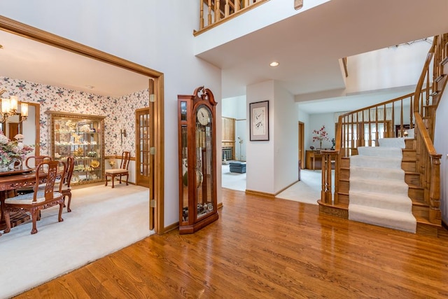 foyer entrance featuring hardwood / wood-style flooring and an inviting chandelier