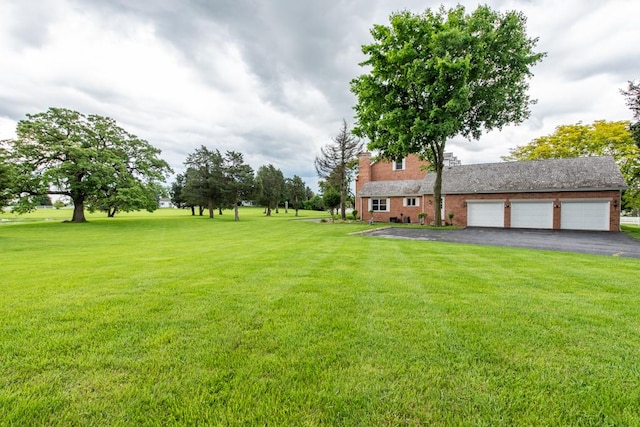 view of yard featuring a garage