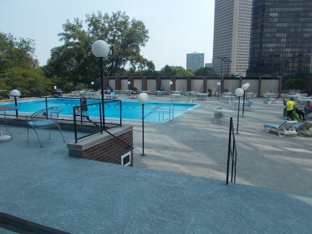 view of pool featuring a patio area