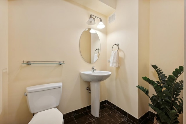 bathroom featuring sink and toilet