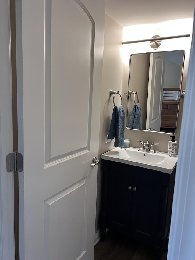 bathroom featuring wood finished floors and vanity