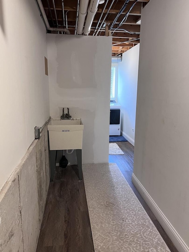 interior space featuring a sink and wood finished floors