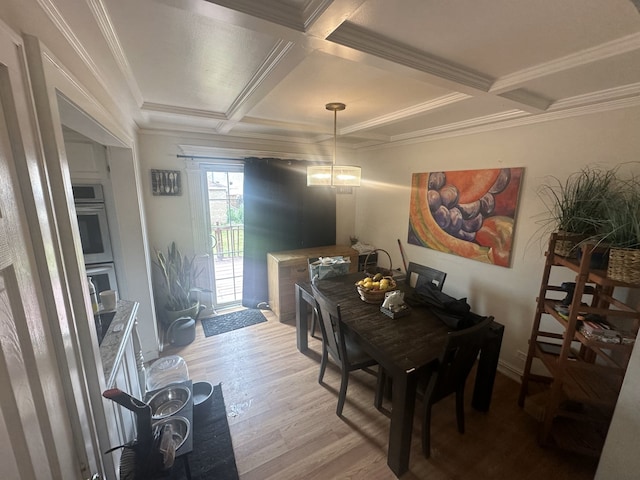 dining space with beamed ceiling, light hardwood / wood-style floors, crown molding, and coffered ceiling