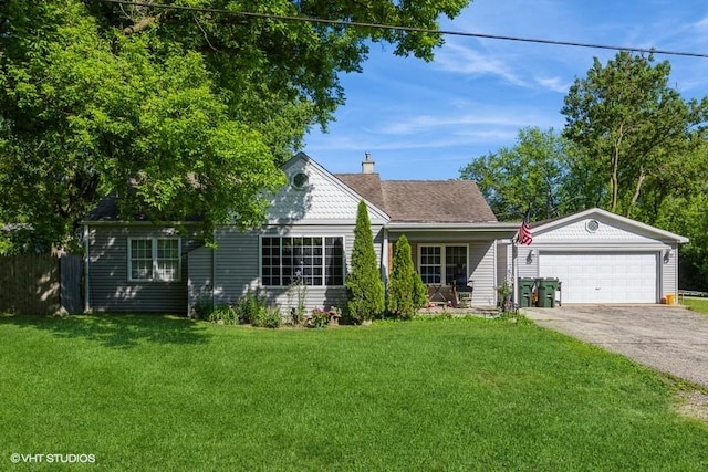 view of front of house with a garage and a front yard