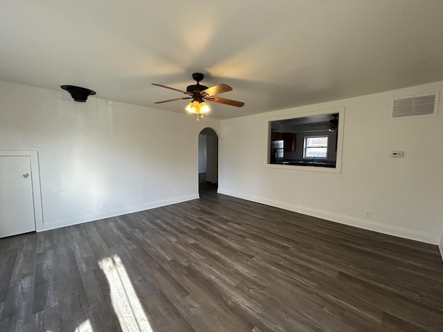 spare room featuring dark hardwood / wood-style flooring