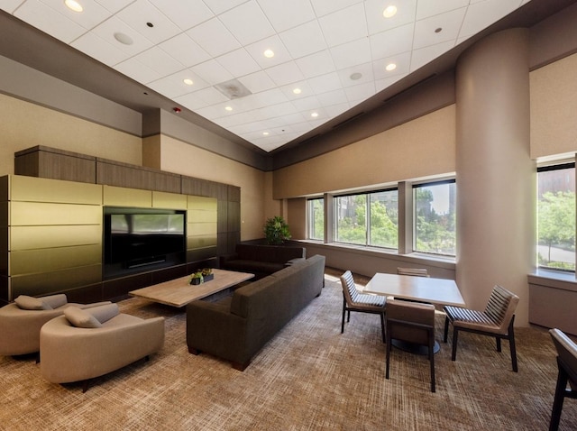 interior space featuring carpet flooring and a high ceiling