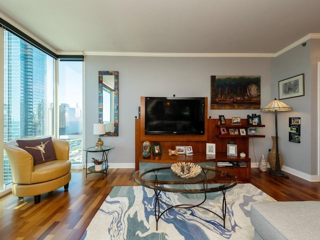 living room with dark hardwood / wood-style floors, plenty of natural light, and ornamental molding