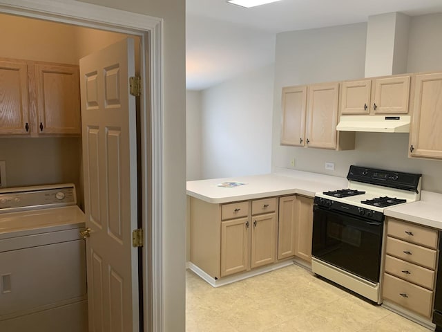 kitchen featuring washer / dryer, white stove, and light brown cabinets