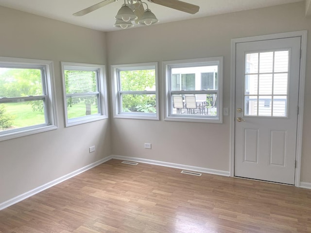 interior space with ceiling fan