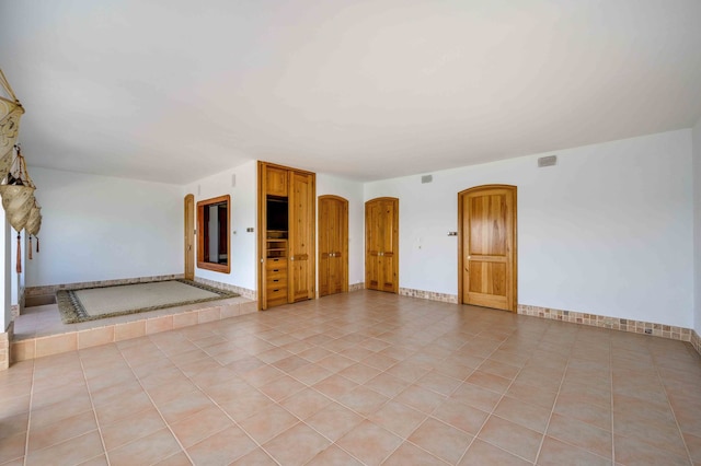 view of tiled spare room