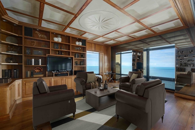 living room featuring coffered ceiling, built in features, and light wood-type flooring