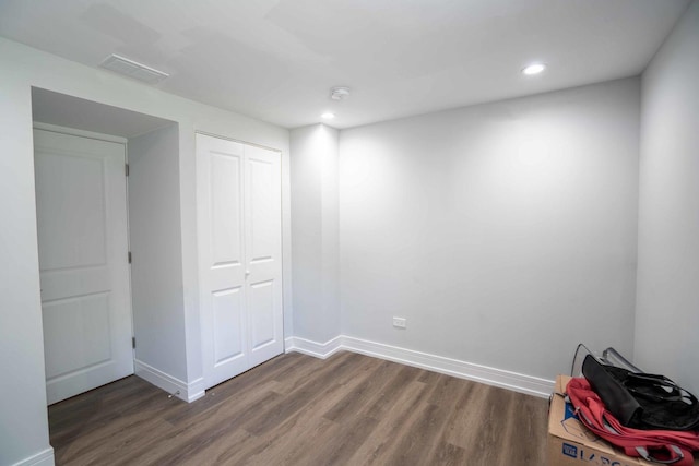 empty room featuring dark wood-type flooring