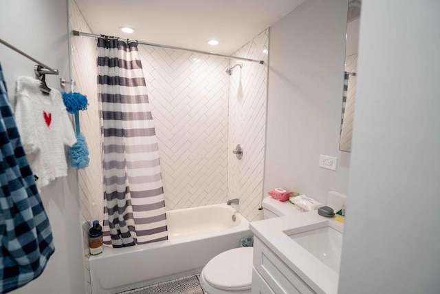 full bathroom featuring vanity, shower / bathtub combination with curtain, and toilet