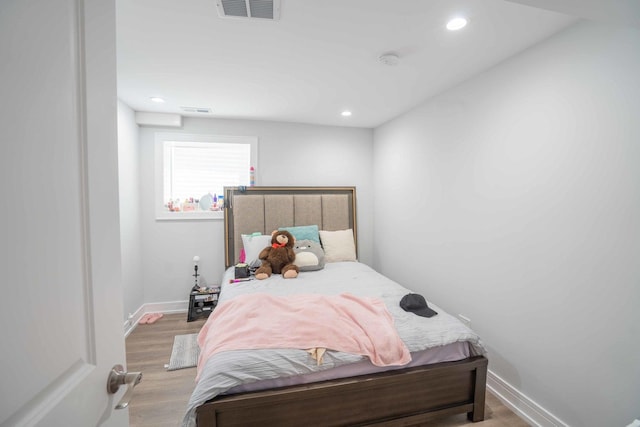 bedroom with light wood-type flooring