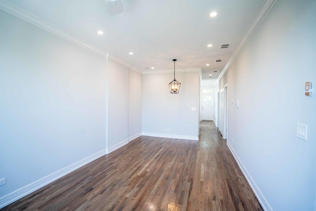 unfurnished room with crown molding and dark wood-type flooring