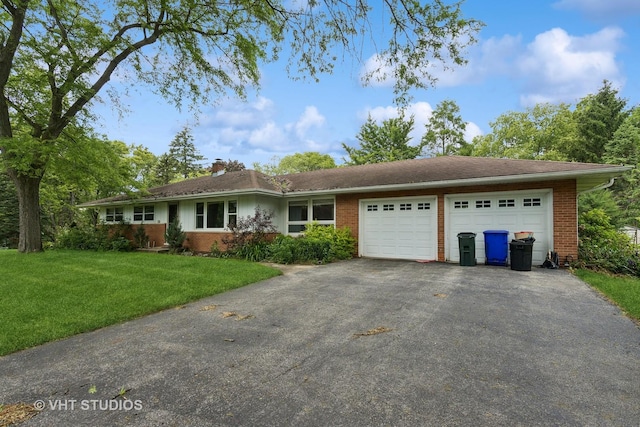 ranch-style home featuring a garage and a front lawn