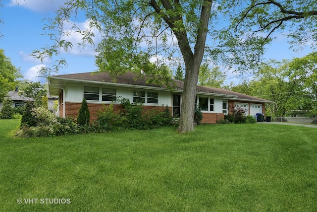 ranch-style home with a garage and a front lawn