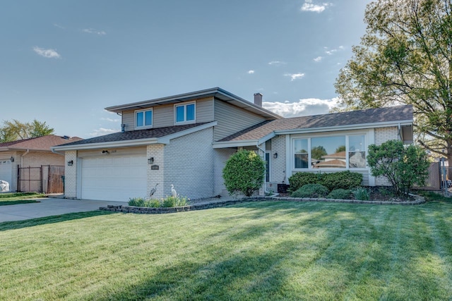 tri-level home with a garage and a front yard