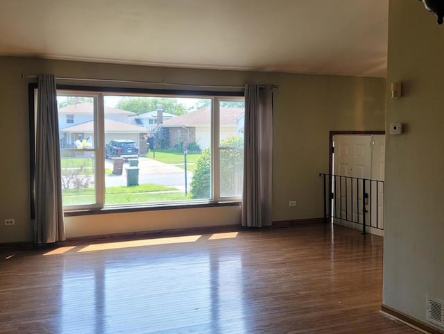 empty room featuring hardwood / wood-style flooring