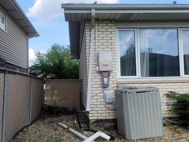 view of side of home featuring central AC