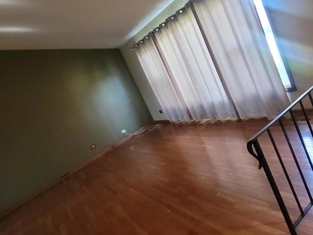 unfurnished room featuring wood-type flooring