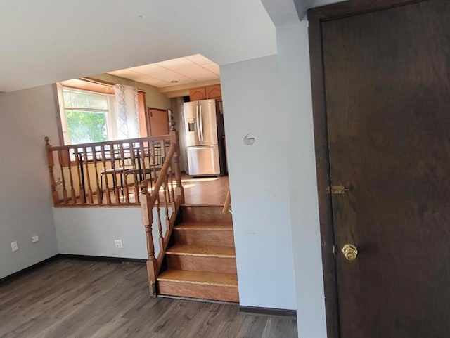 staircase featuring hardwood / wood-style flooring