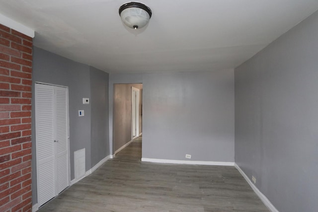 spare room featuring light wood-type flooring