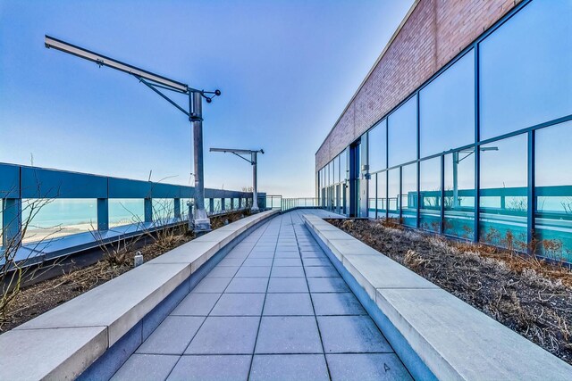 view of swimming pool with a water view