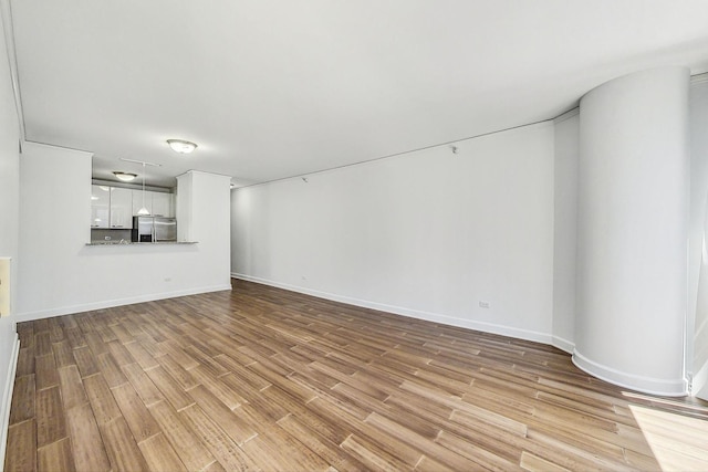 unfurnished living room featuring light hardwood / wood-style flooring