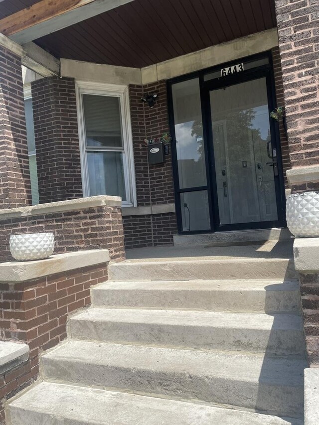 doorway to property featuring covered porch