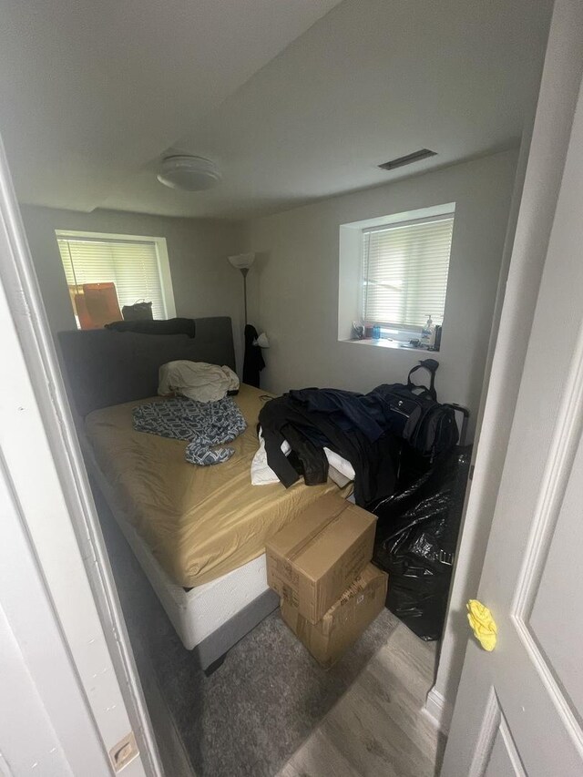 bedroom with wood-type flooring