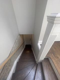 stairway featuring hardwood / wood-style floors